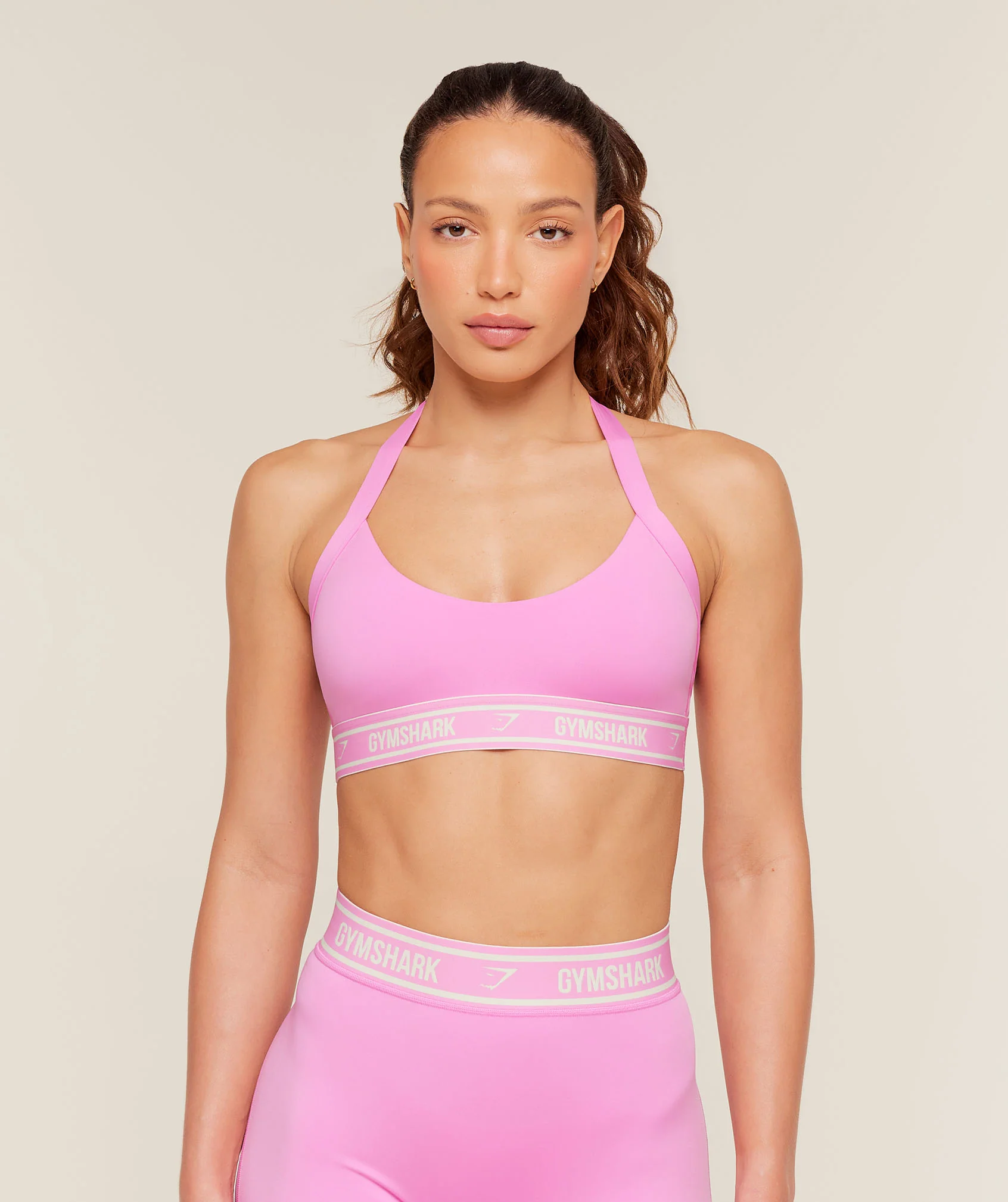 Gymshark Light Support Halter Neck Logo Sports Bra in Pink